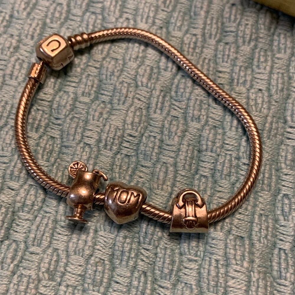 Beautiful 925 Camilla bracelet with three charms.
